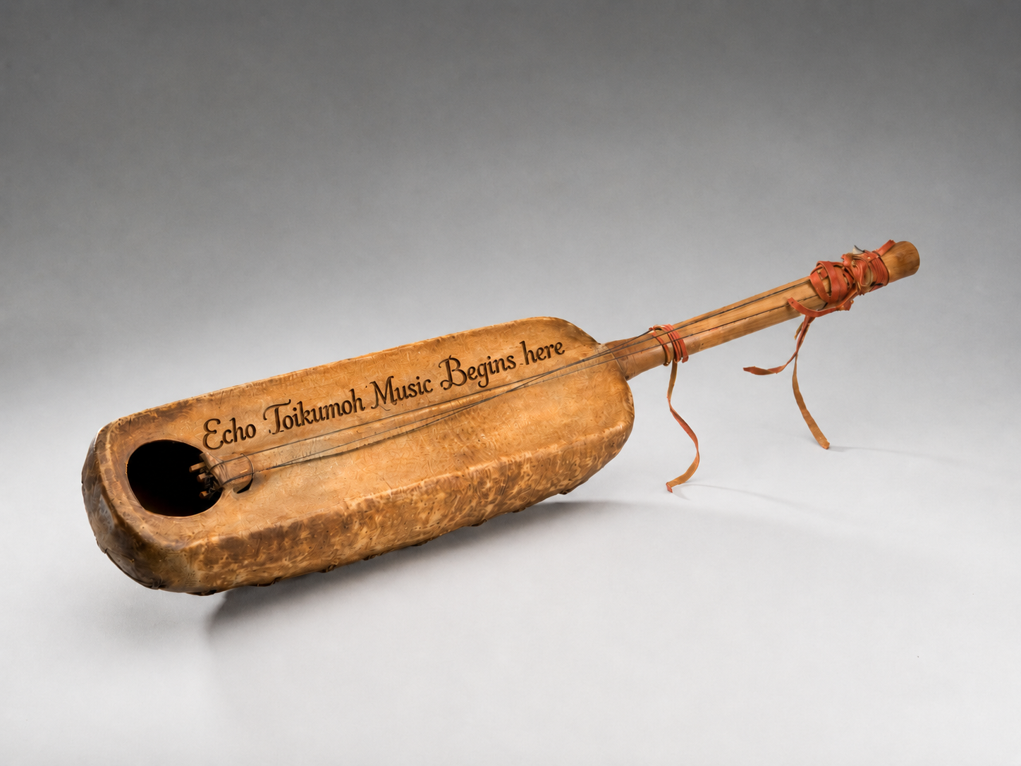 Molo instrument with the words Echo Toikumoh Music Begins here written across it